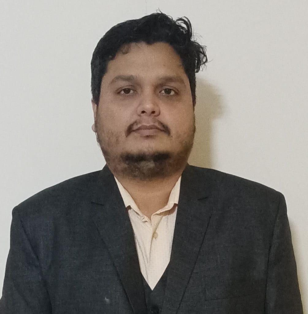 professional editorial portrait of a confident middle-aged Indian male doctor in a white clinical co